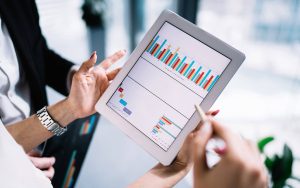 woman looking at a digital chart on a table