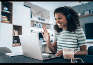 Illustration of a virtual meeting with people connecting on screen—symbolizing collaboration, coaching, and professional growth in an online space.